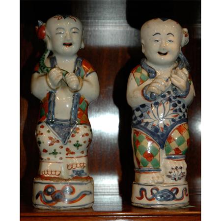 Appraisal: Pair of Chinese Porcelain Figures of Boys Estimate -