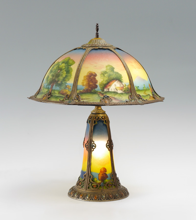 Appraisal: ATTRIB PITTSBURGH REVERSE PAINTED SHADE AND BASE LAMP Patinated cast