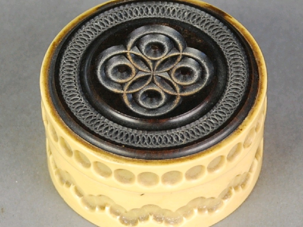 Appraisal: CARVED EBONY AND BONE CIRCULAR TRINKET BOX and COVER diameter