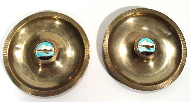 Appraisal: Two circular ashtrays enamelled to the centres with Hunter military