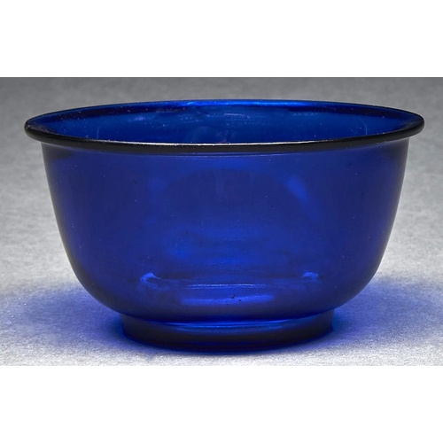 Appraisal: A Chinese blue glass bowl the rounded sides beneath flange