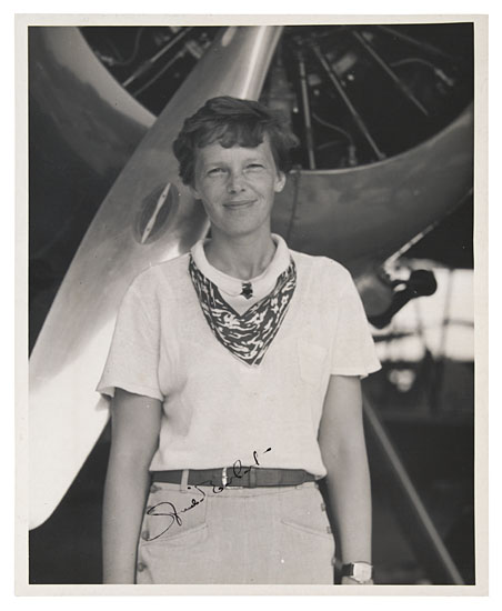 Appraisal: EARHART AMELIA Photograph Signed showing the smiling aviator in short