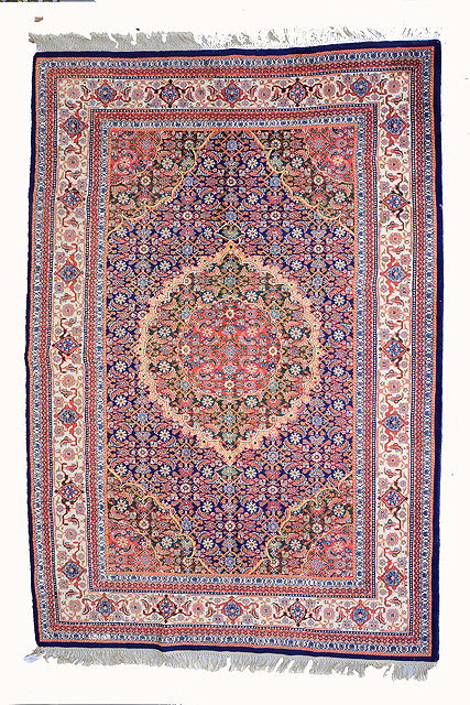 Appraisal: AN INDIAN PERSIAN PATTERN LARGE RUG with a central medallion