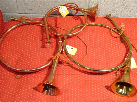 Appraisal: THREE HUNTING HORNS Two copper and one brass largest measures