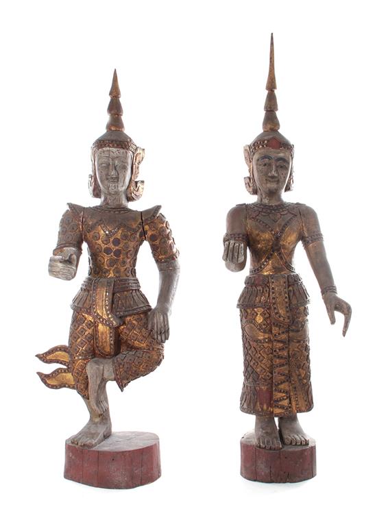 Appraisal: Pair Thai carved and painted wood Deities th th century