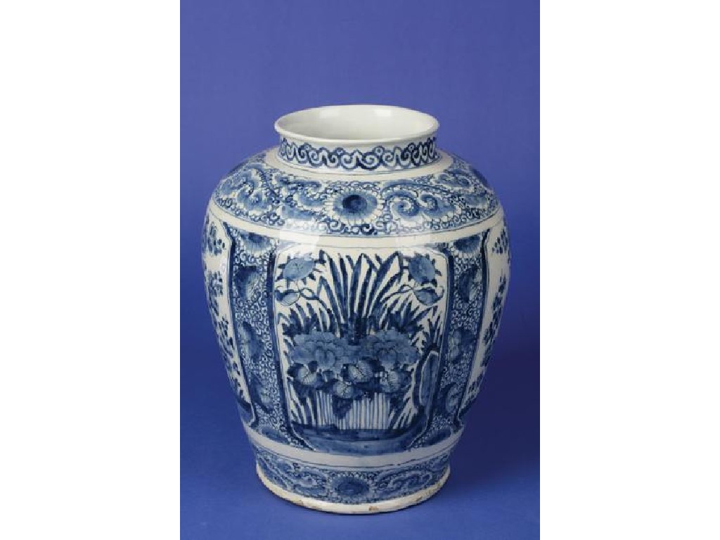 Appraisal: A DELFTWARE BLUE AND WHITE VASE decorated with four panels