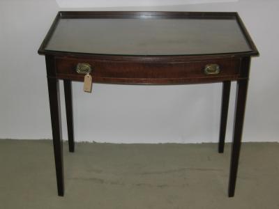 Appraisal: A MAHOGANY SIDE TABLE of bowed form the reeded edged