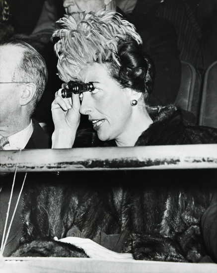 Appraisal: WEEGEE - Untitled woman holding opera glasses Ferrotyped silver print