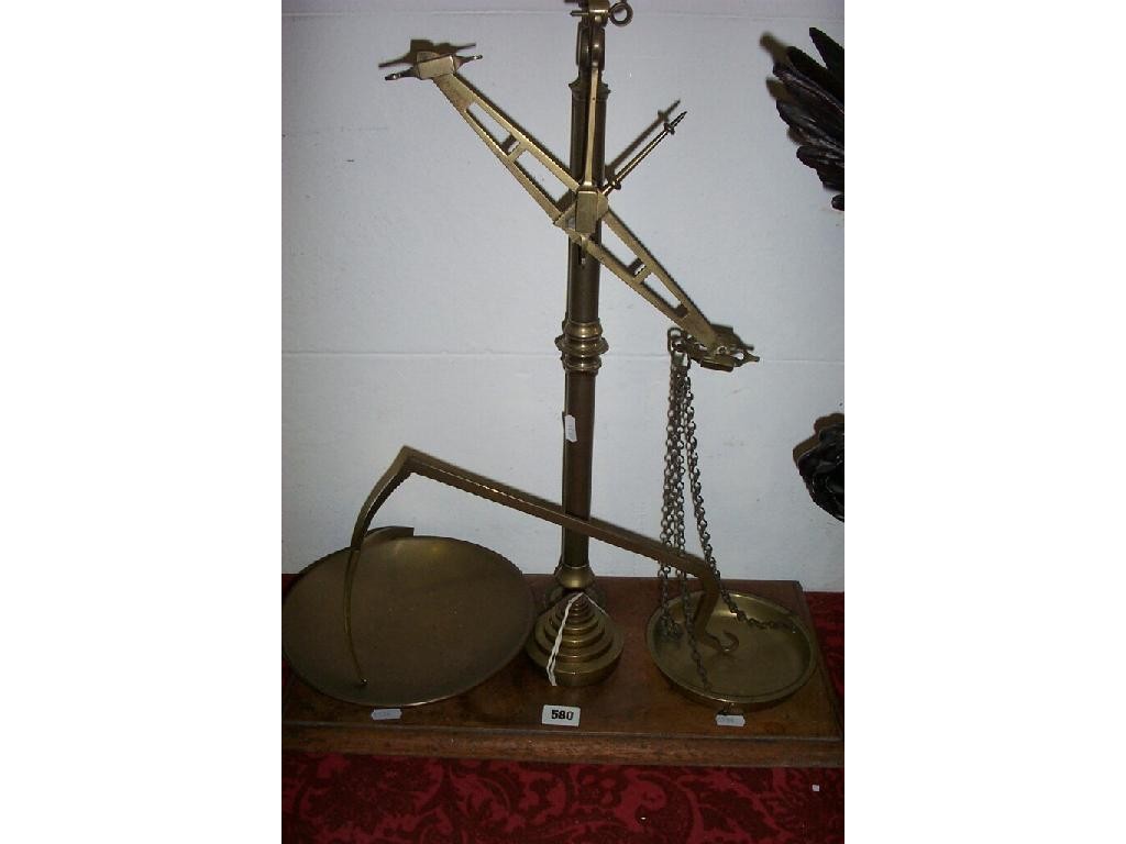 Appraisal: A set of late th century brass balance scales and