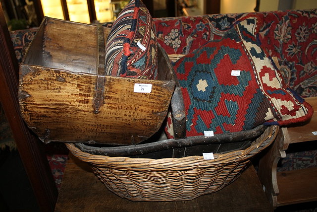 Appraisal: TWO OLD TRUNKS a wicker log basket and two Kelim