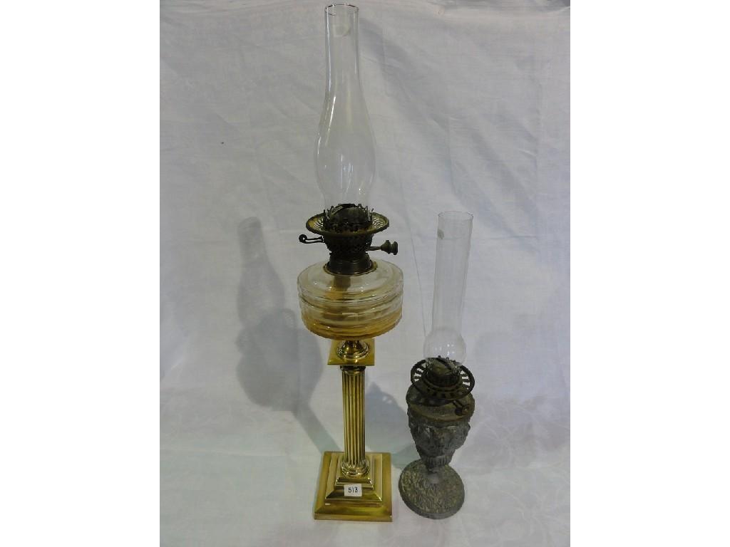 Appraisal: A Victorian oil lamp with faceted glass font raised on