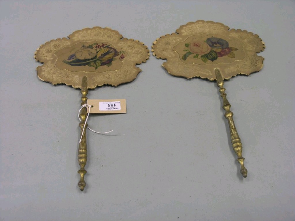 Appraisal: A pair of Victorian handscreens floral-painted card with gilded and