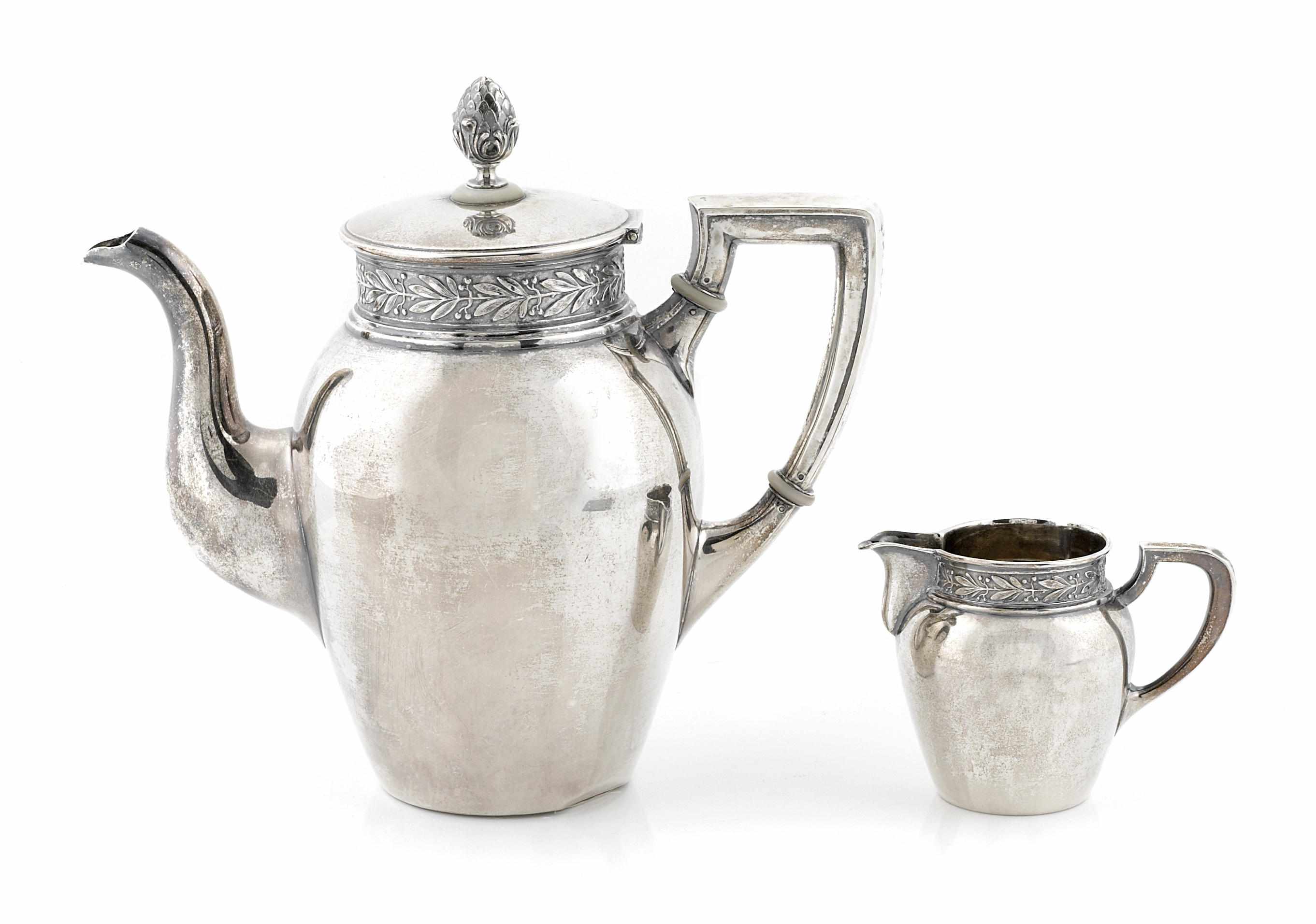 Appraisal: A Swiss standard silver coffee pot and cream jug Jezler