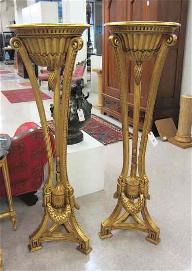 Appraisal: A PAIR OF LOUIS XVI STYLE GILTWOOD TORCHIERE PLANTSTANDS each