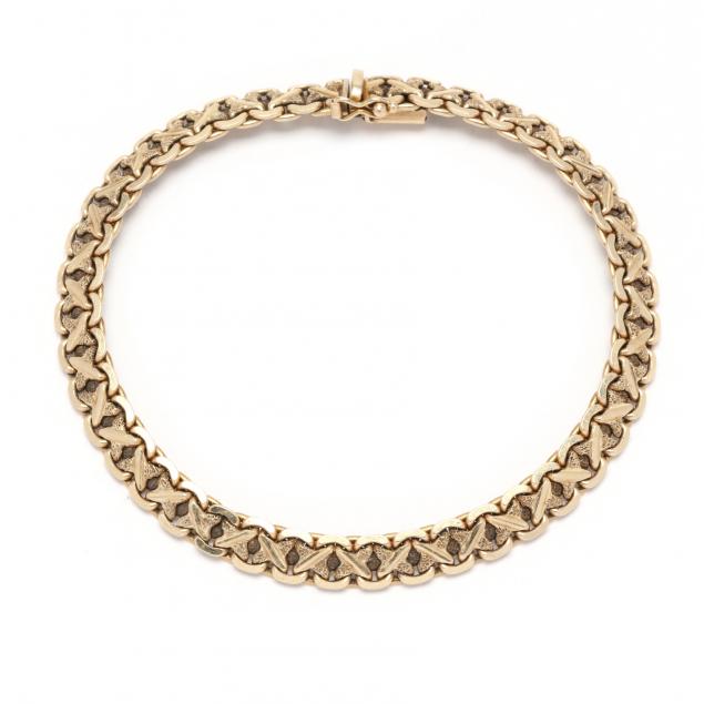 Appraisal: GOLD BRACELET Necklace in a stylized repeating X motif with