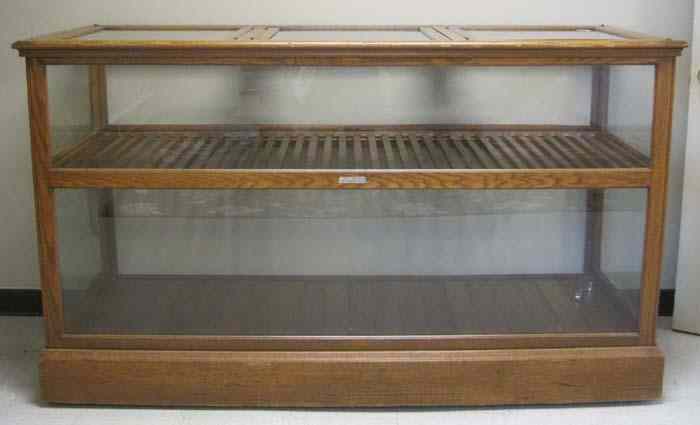 Appraisal: ANTIQUE OAK AND GLASS SHOWCASE American c Dimensions ''H x