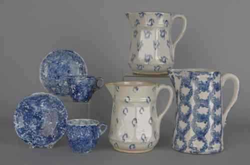 Appraisal: Three blue and white spongeware pitchers th c together with