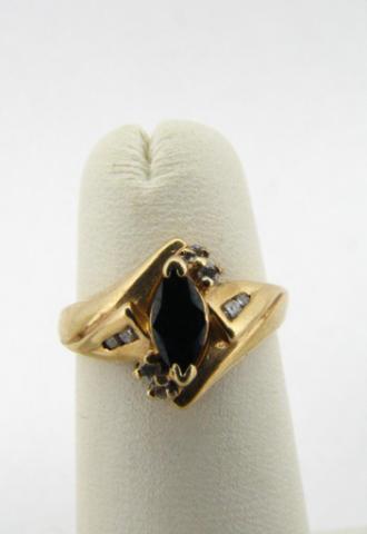 Appraisal: Lady's K yellow gold ring with marquis Sapphire center and