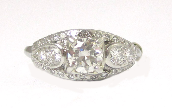 Appraisal: DIAMOND AND FOURTEEN KARAT WHITE GOLD RING featuring a round-cut