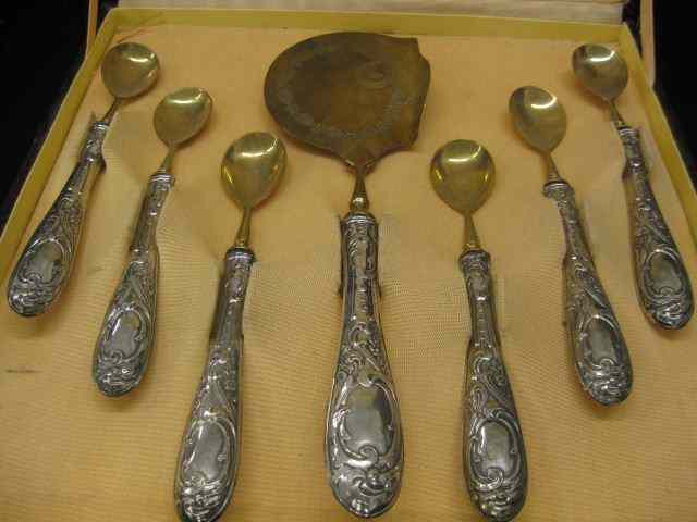 Appraisal: European Silver Aspic Serving Set fine fancy handles gilt brass