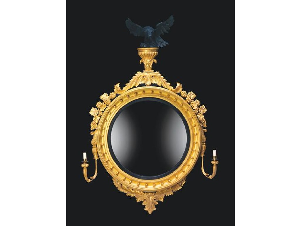 Appraisal: A LARGE REGENCY STYLE GILTWOOD CONVEX WALL MIRROR the circular