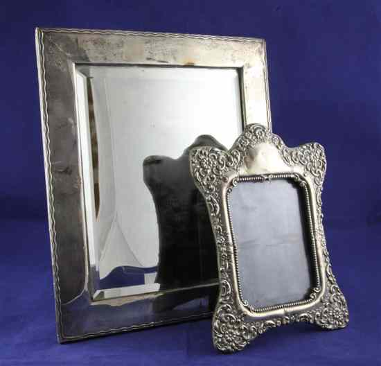 Appraisal: A George V silver mounted rectangular mirror decorated with wavy