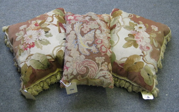 Appraisal: Two Aubusson tapestry cushions worked with floral sprays in shades