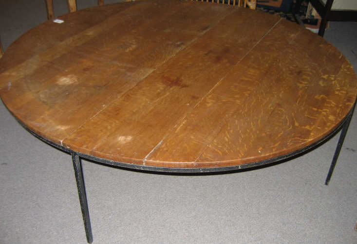 Appraisal: CIRCULAR LOW TABLE with multiple board top raised on iron