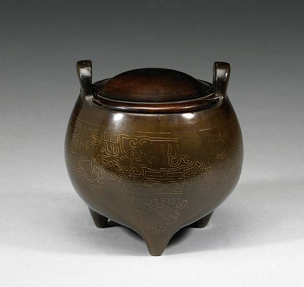 Appraisal: A silver wire-inlaid bronze tripod censer th th Century Of