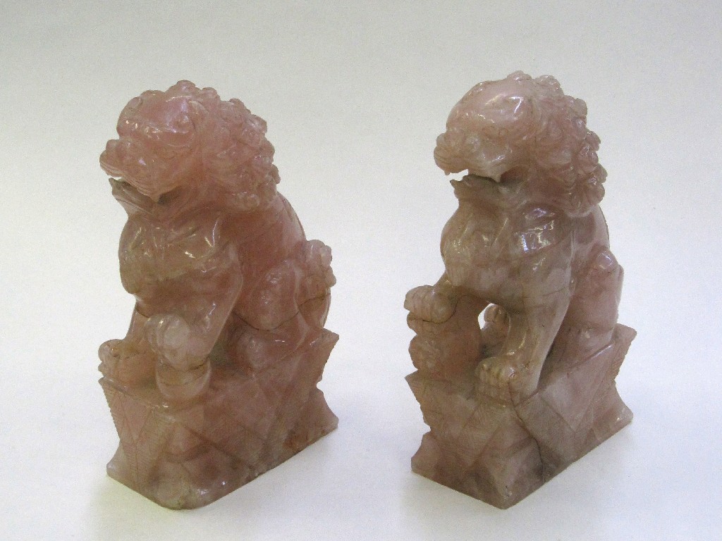 Appraisal: Pair of rose quartz dogs of fo with stands