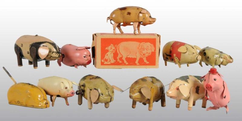 Appraisal: Lot of Tin Pig Wind-Up Toys Description Japanese German and