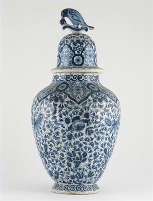 Appraisal: A Dutch Delft vase and cover of lightly ribbed form