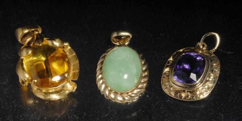 Appraisal: Lot of Y Gold Pendants Description Includes one K with