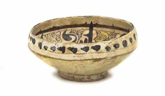 Appraisal: A Nishapur Pottery Bowl th century decorated in cream and