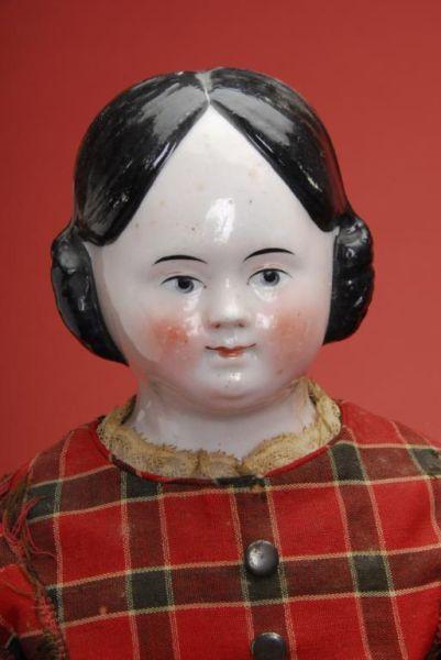 Appraisal: China Doll with Covered Wagon Hairstyle Germany ca a fine