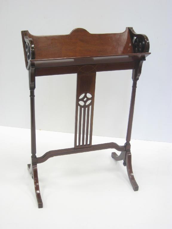 Appraisal: An Edwardian mahogany Bookstand with satinwood stringing and pierced detail