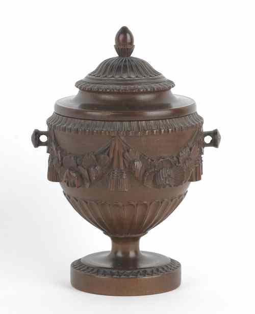 Appraisal: American carved cherry lidded urn ca in the style of