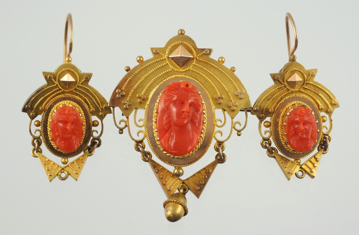 Appraisal: Unmarked YG Etruscan carved coral cameo pin with matching earrings