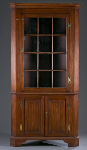 Appraisal: Henkel Harris Corner Cupboard Mahogany Molded cornice twelve window cabinet