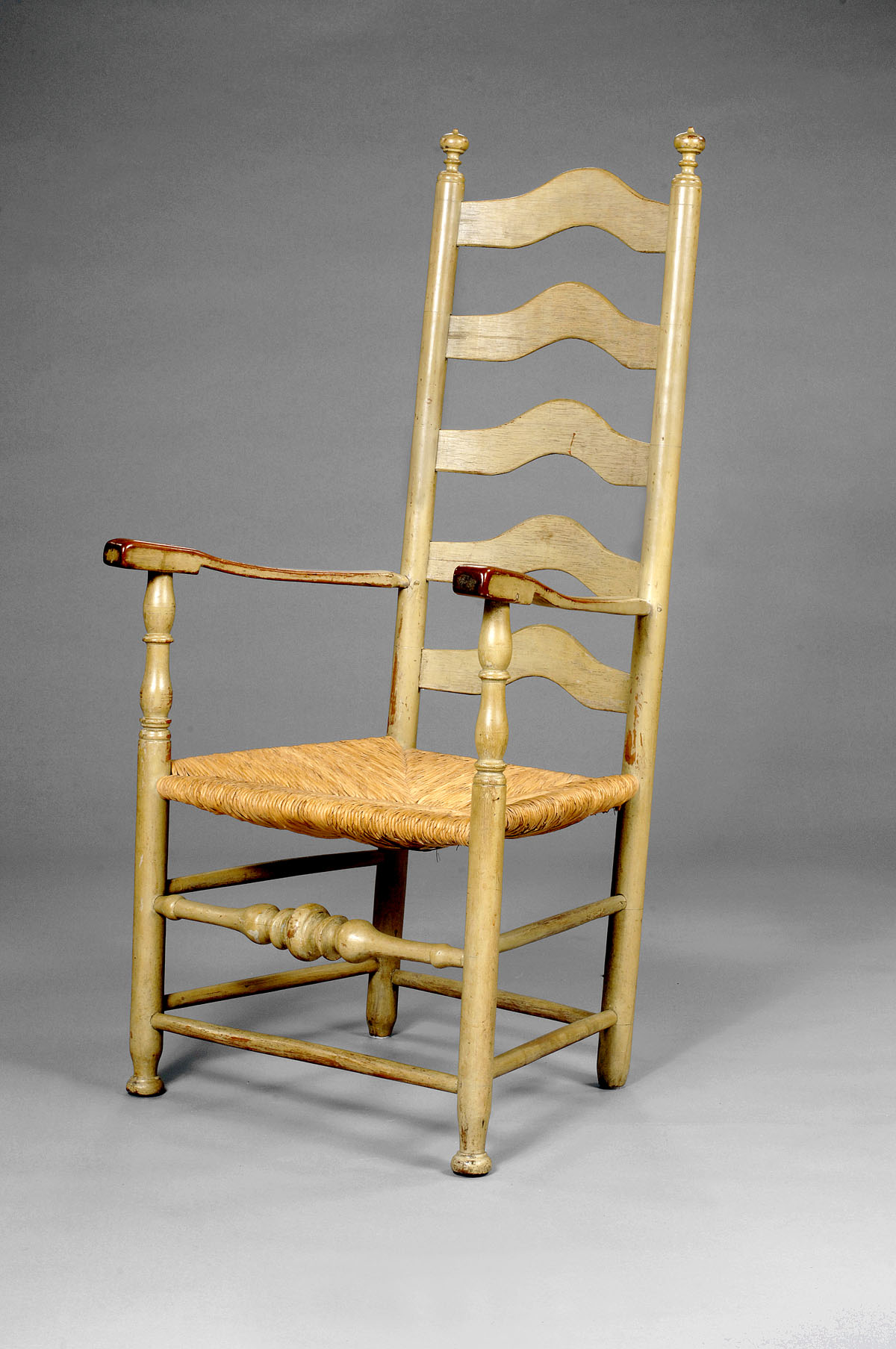 Appraisal: PENNSYLVANIA LADDERBACK ARMCHAIR IN SAGE- GREEN PAINT The serpentine slats