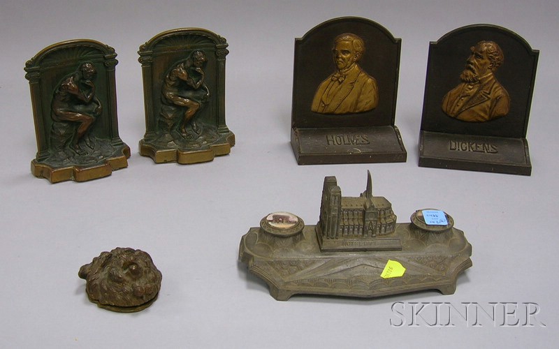 Appraisal: Six Metal Desk Items a pair of bronze bookends depicting