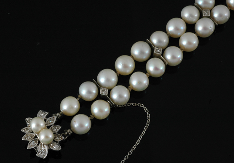 Appraisal: A cultured pearl and diamond bracelet The double row of