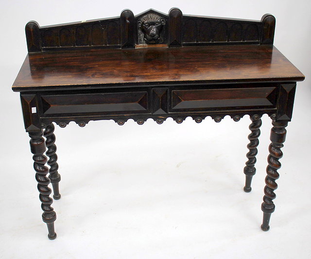 Appraisal: A VICTORIAN OAK SIDE TABLE the raised back with lion