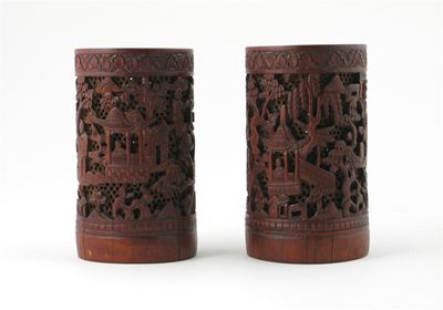 Appraisal: A pair of bamboo brushpots carved in relief with figures