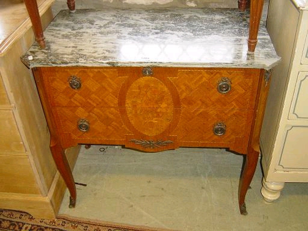 Appraisal: A continental commode the marble top over two long drawers