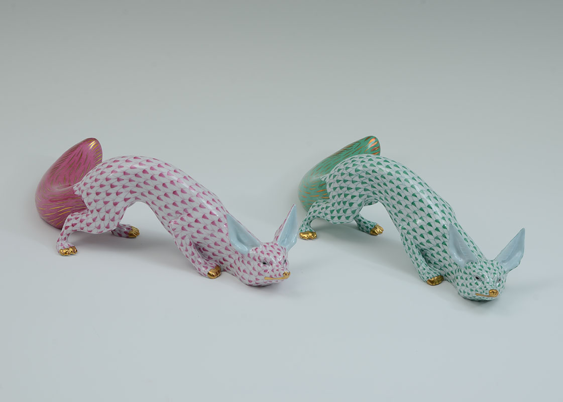 Appraisal: HEREND FISHNET FOX FIGURINES GREEN RASPBERRY fishnet porcelain figures of