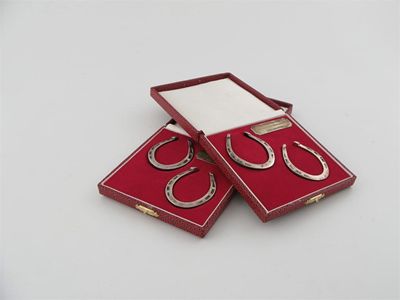 Appraisal: Horse racing Two modern cased pairs of 'horseshoe' napkin rings