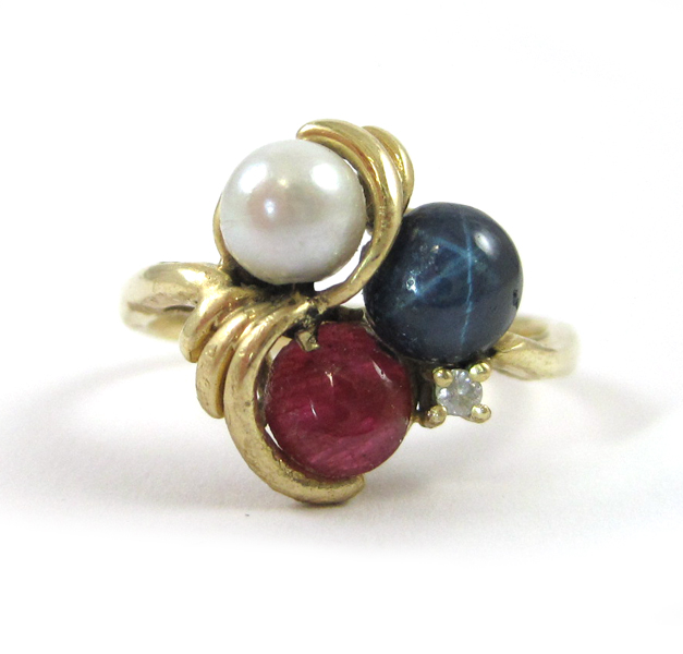 Appraisal: RUBY STAR SAPPHIRE PEARL AND DIAMOND RING The k yellow