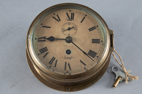 Appraisal: Antique brass Ships Clock spring driven movement paper dial marked