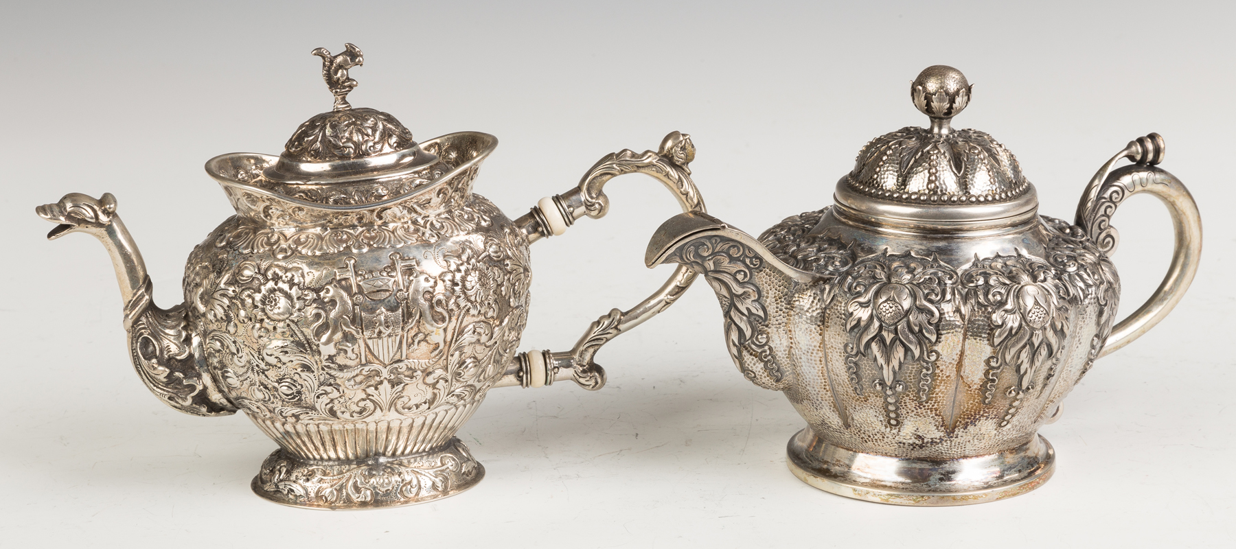 Appraisal: Two Silver Teapots th century L Silver Teapot with repouse